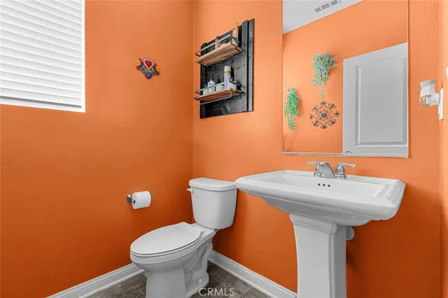 a living room with furniture and a book shelf