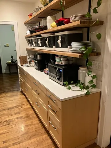 a living room with a stove and a table