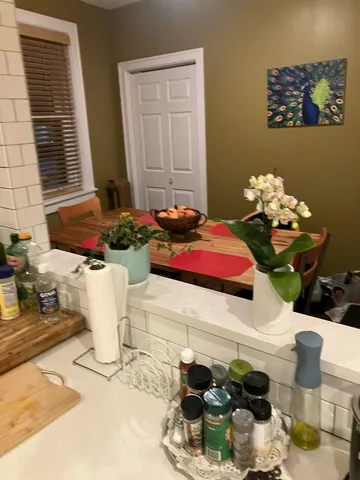 a bathroom with a sink mirror and vanity