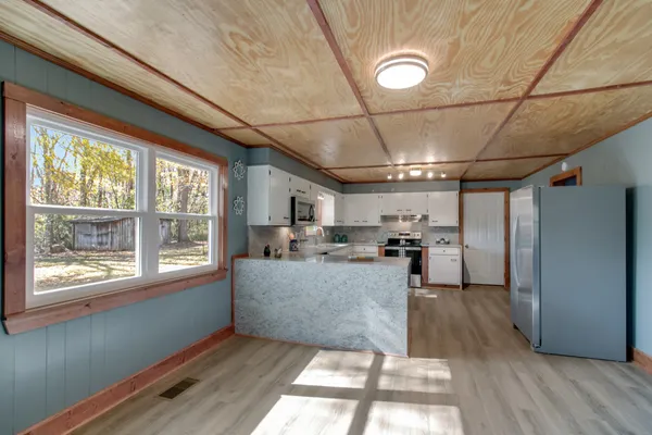 a kitchen with a sink and a stove