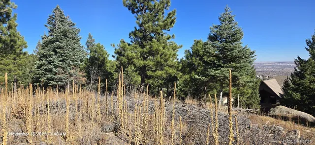 a view of a road with a building in the background