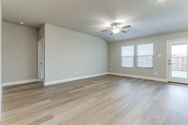 a view of kitchen with sink and wooden floor
