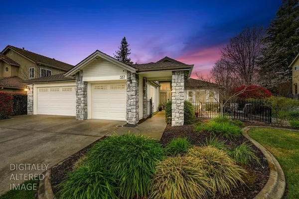 a front view of a house with garden