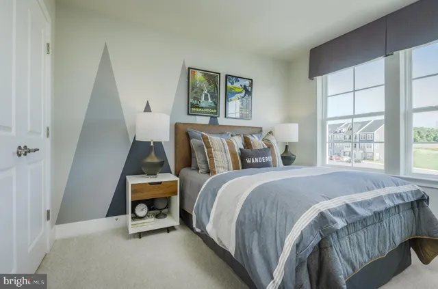 a bed room with a bed and a window