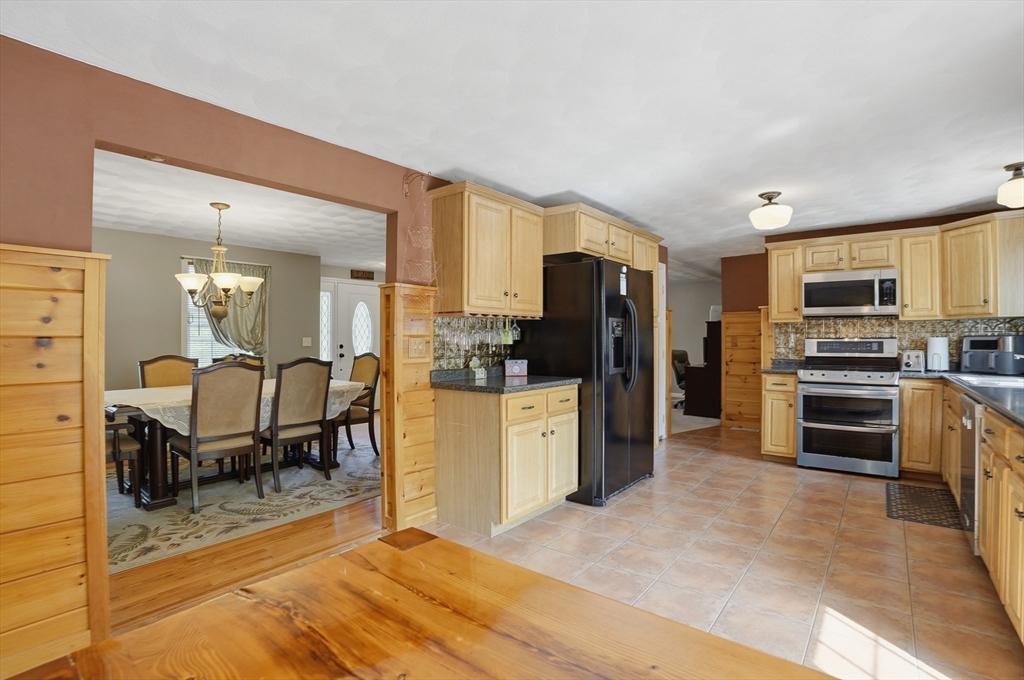 160 Gray Road Templeton, MA 01468 - Photo 14 of 42 a kitchen with stainless steel appliances a refrigerator and a stove top oven