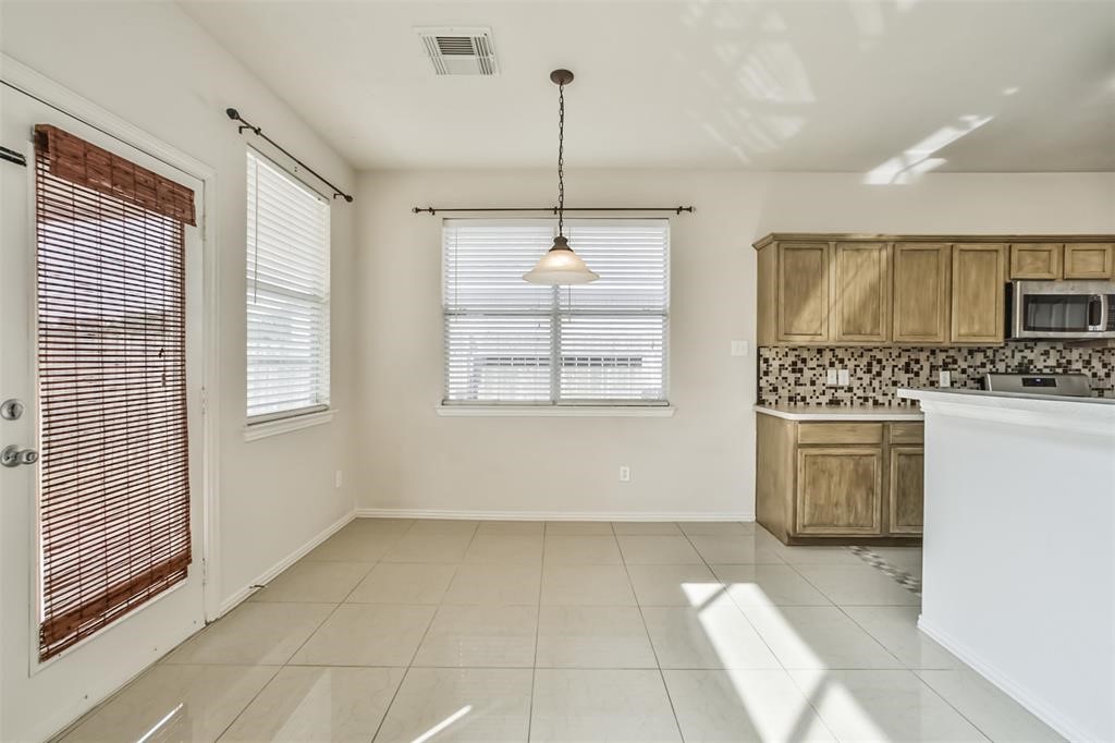 911 Merlin Roost Katy, TX 77494 - Photo 17 of 42 a view of kitchen with furniture and window