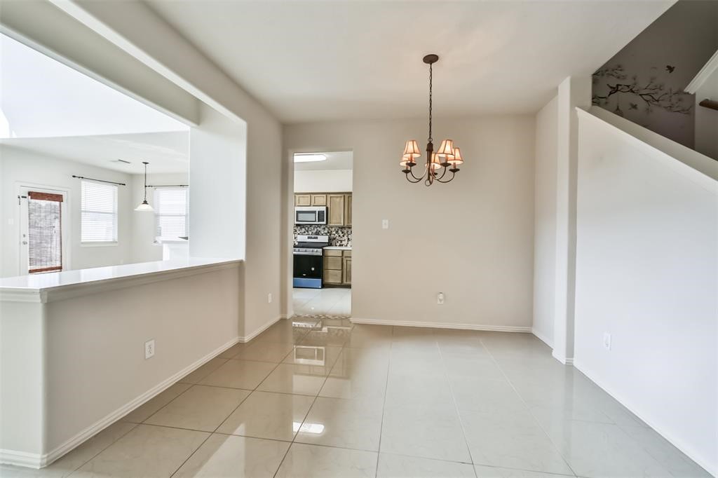 911 Merlin Roost Katy, TX 77494 - Photo 19 of 42 a view of a kitchen with a sink and dishwasher kitchen view