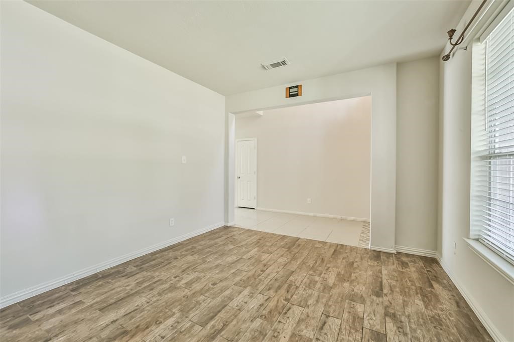 911 Merlin Roost Katy, TX 77494 - Photo 23 of 42 an empty room with a natural light
