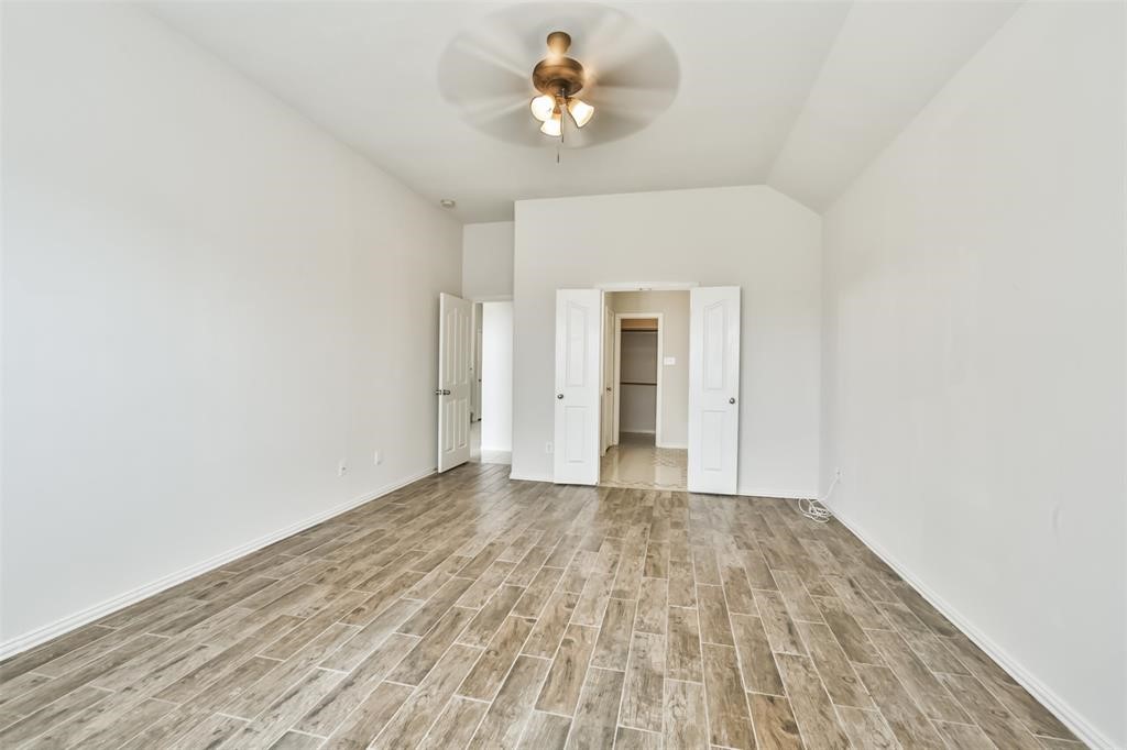 911 Merlin Roost Katy, TX 77494 - Photo 26 of 42 a view of empty room with wooden floor