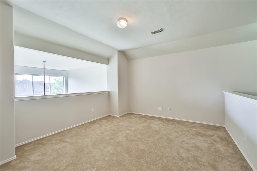 911 Merlin Roost Katy, TX 77494 - Photo 32 of 42 a view of an empty room with a window