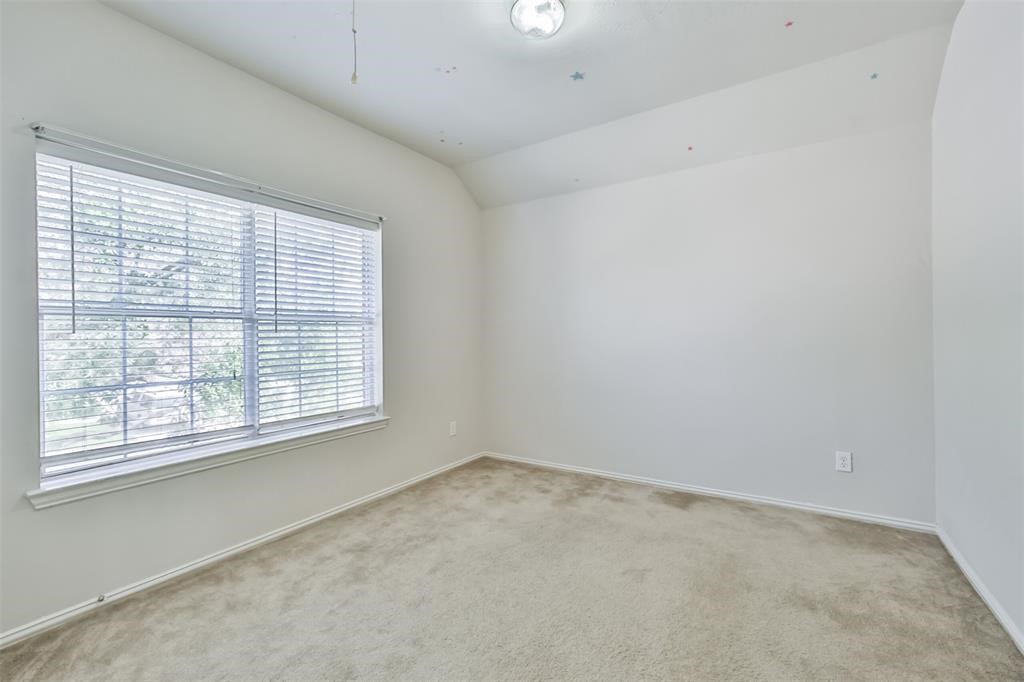 911 Merlin Roost Katy, TX 77494 - Photo 38 of 42 an empty room with a window