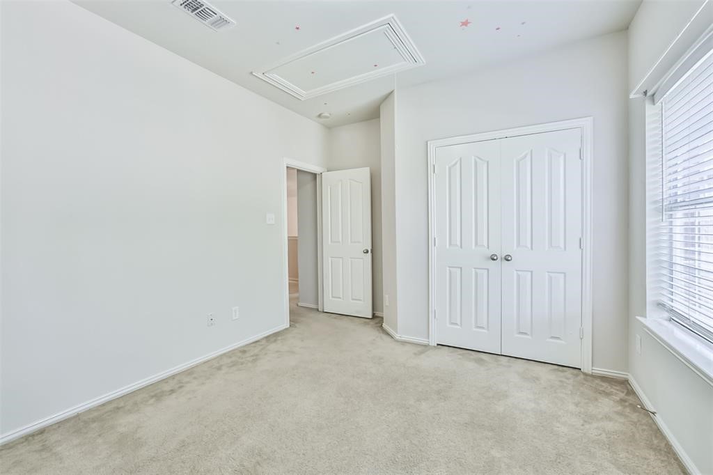 911 Merlin Roost Katy, TX 77494 - Photo 39 of 42 an empty room with windows
