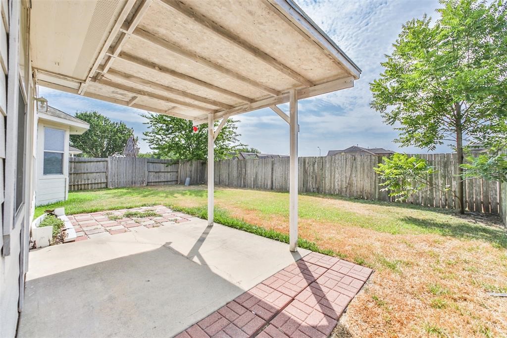 911 Merlin Roost Katy, TX 77494 - Photo 40 of 42 a view of a backyard with a swimming pool