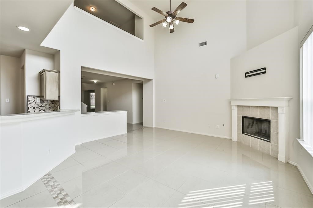 911 Merlin Roost Katy, TX 77494 - Photo 8 of 42 a view of a hallway with a fireplace and cabinet