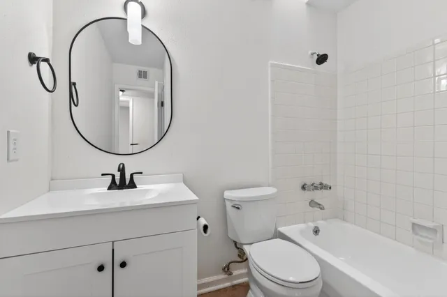 a view of backyard with wooden fence and trees