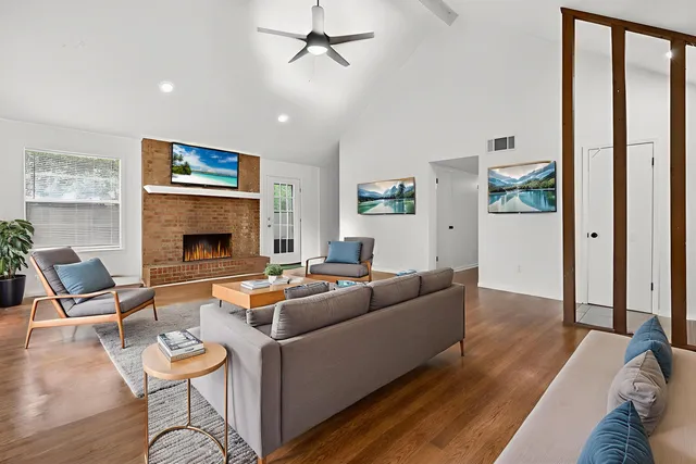 a living room with furniture and a fireplace