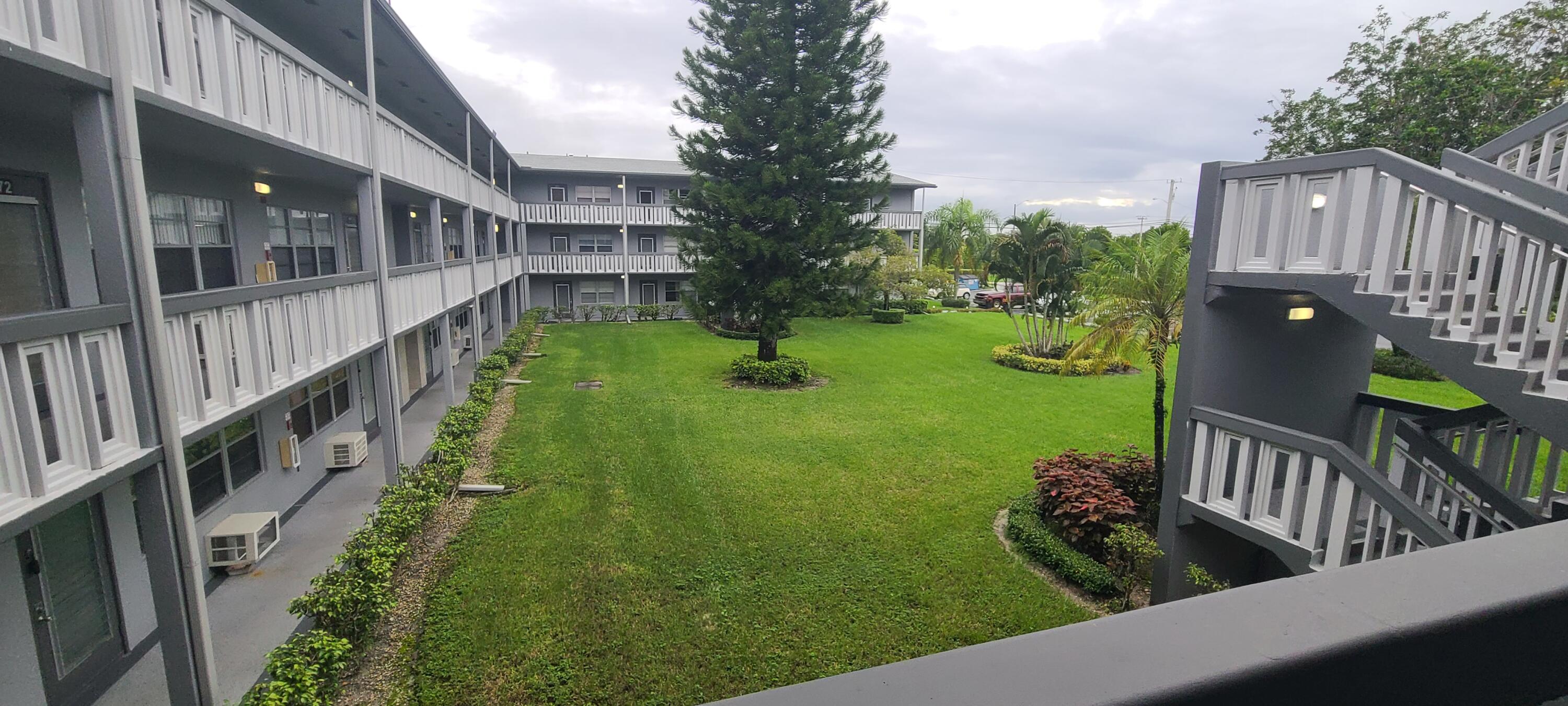 270 Suffolk F Boca Raton, FL 33434 - Photo 20 of 21 a view of building from a balcony