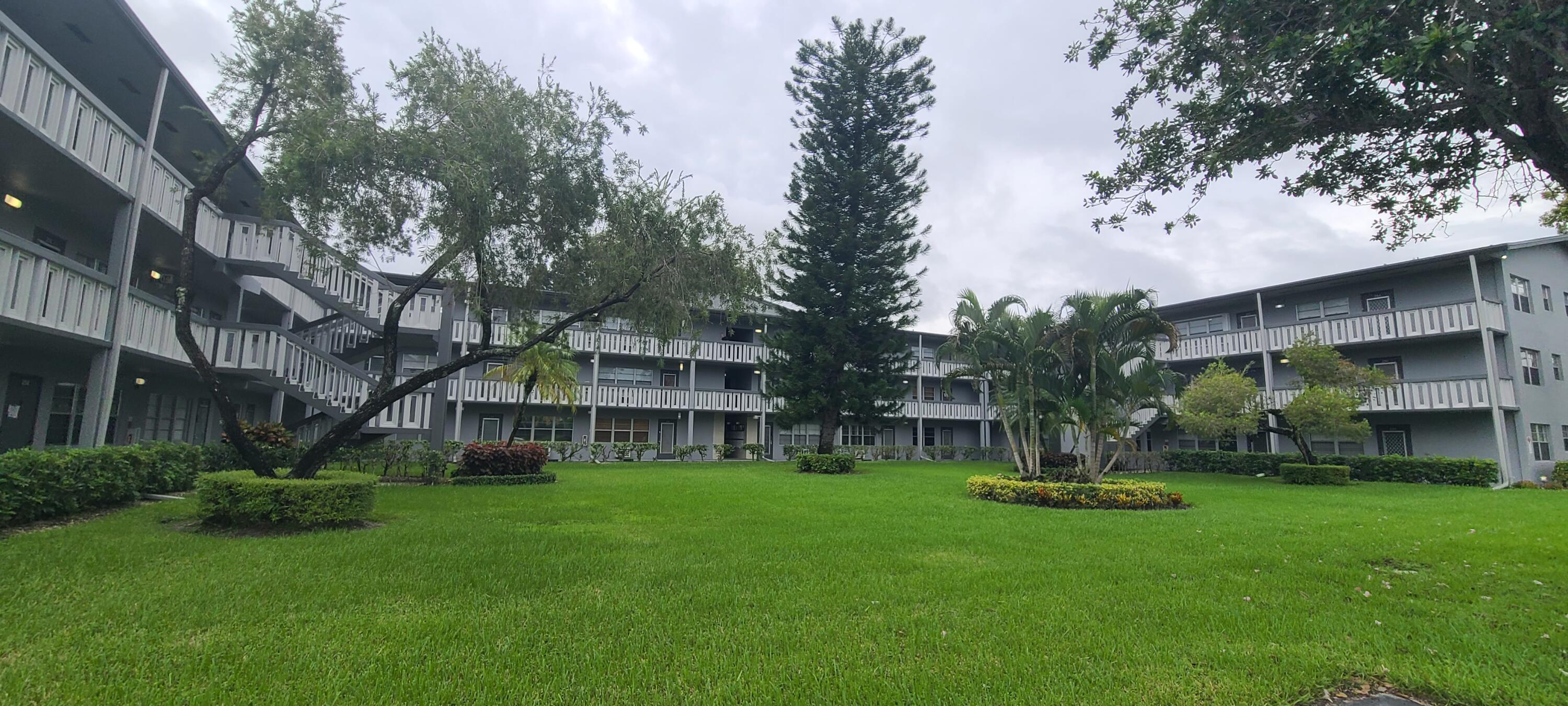 270 Suffolk F Boca Raton, FL 33434 - Photo 2 of 21 a view of an apartment with a garden