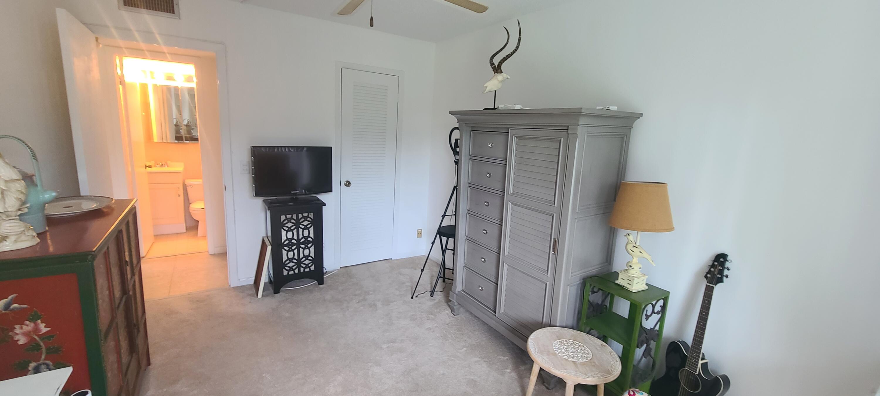 270 Suffolk F Boca Raton, FL 33434 - Photo 8 of 21 a view of entryway with furniture and garden