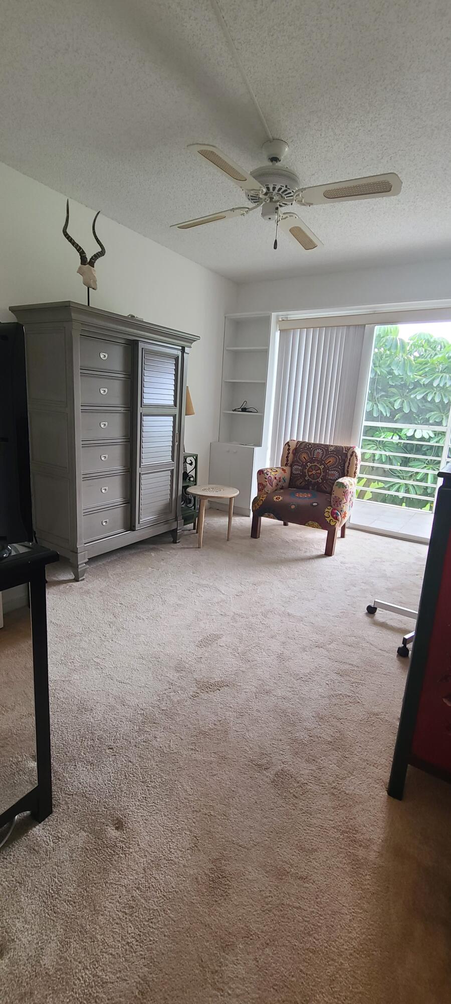 270 Suffolk F Boca Raton, FL 33434 - Photo 9 of 21 a view of a livingroom with furniture and a ceiling fan