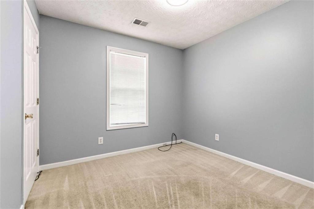4170 Jewel Terrace Conley, GA 30288 - Photo 11 of 29 a view of an empty room with a window
