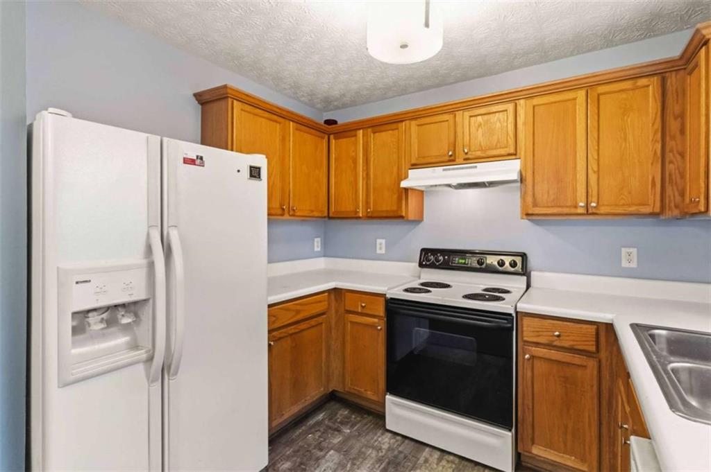 4170 Jewel Terrace Conley, GA 30288 - Photo 12 of 29 a kitchen with a refrigerator sink and stove