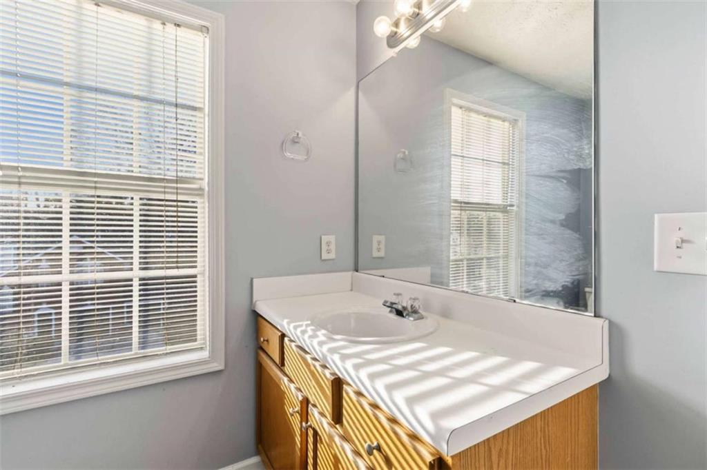 4170 Jewel Terrace Conley, GA 30288 - Photo 21 of 29 a bathroom with a sink and a bathtub