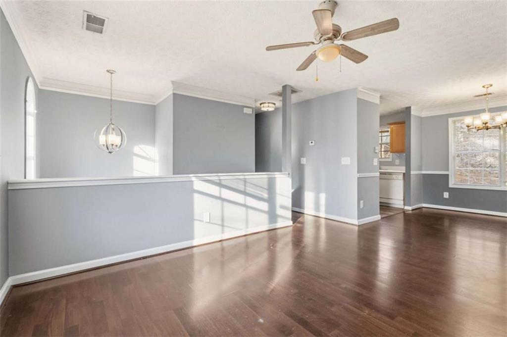 4170 Jewel Terrace Conley, GA 30288 - Photo 5 of 29 a view of an empty room with a window and wooden floor