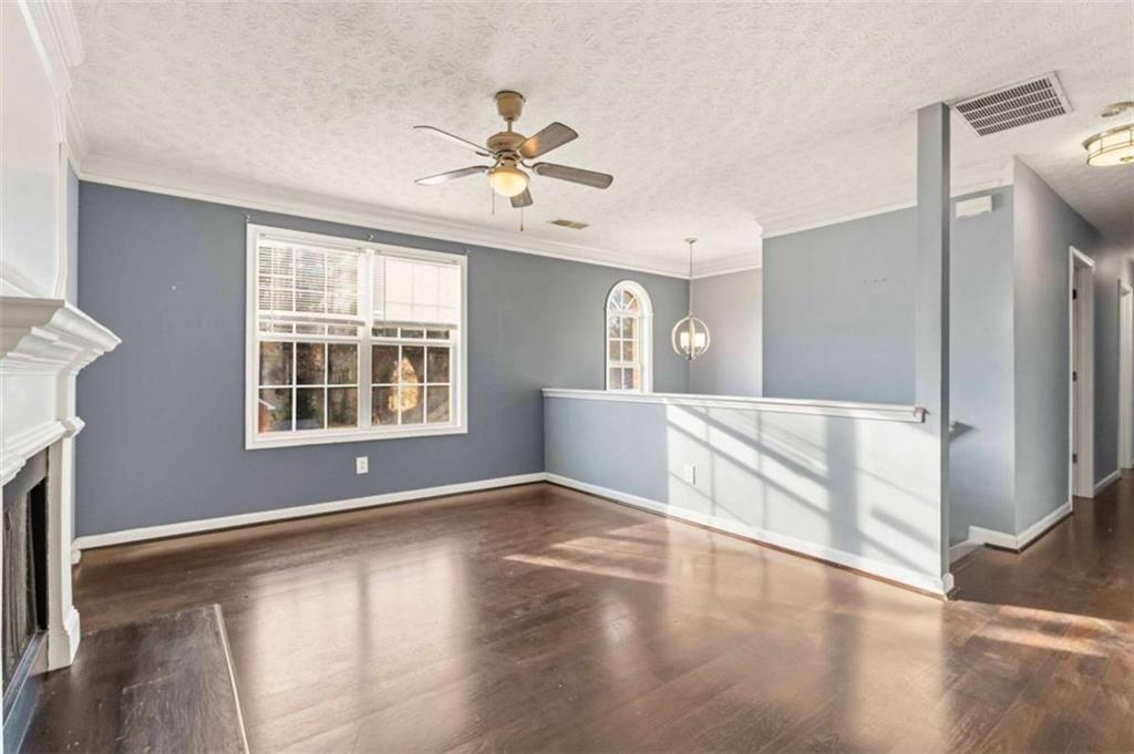 4170 Jewel Terrace Conley, GA 30288 - Photo 6 of 29 a view of an empty room with window and wooden floor