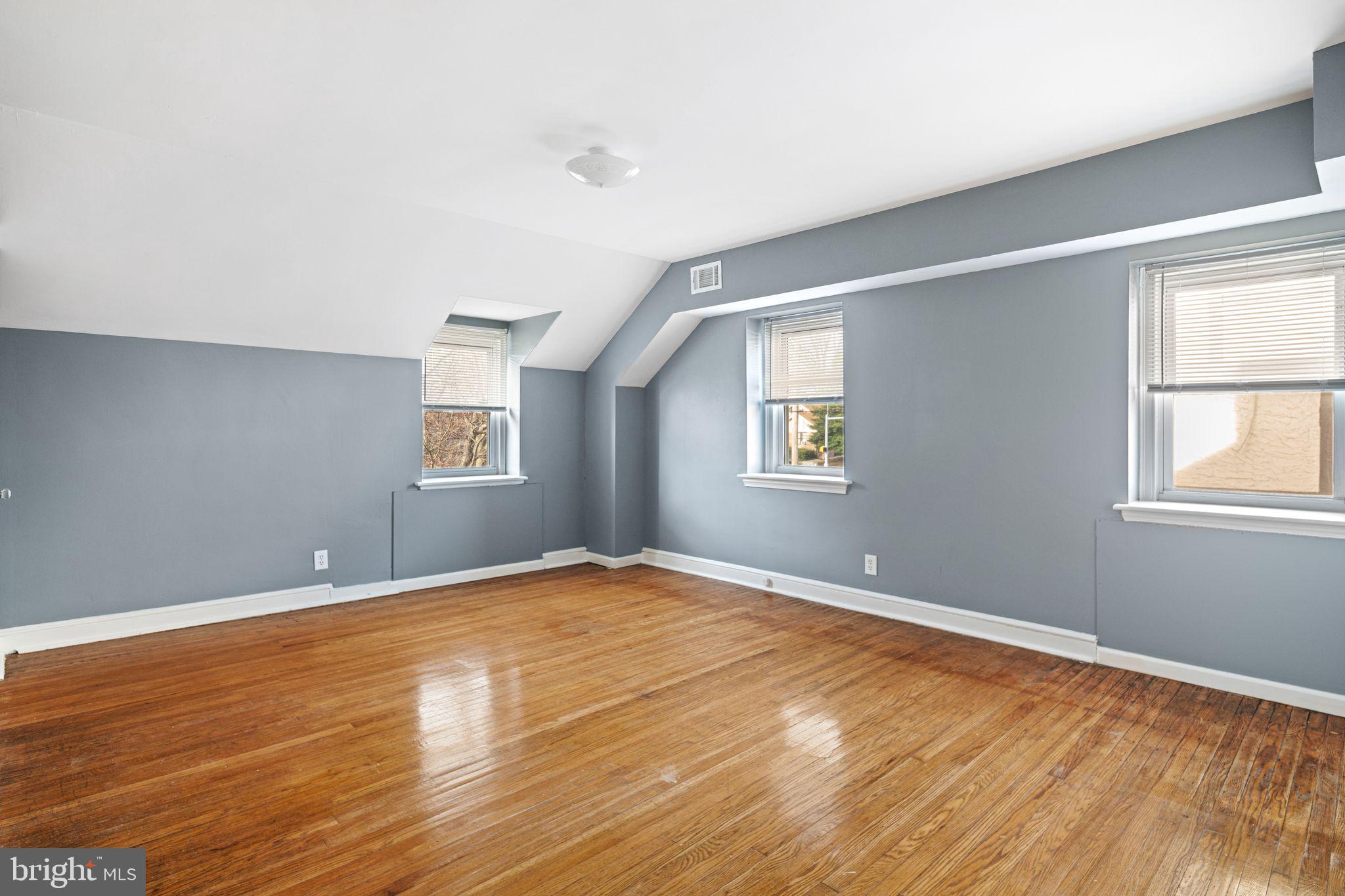 4310 State Road Drexel Hill, PA 19026 - Photo 13 of 24 a view of an empty room with wooden floor and a window