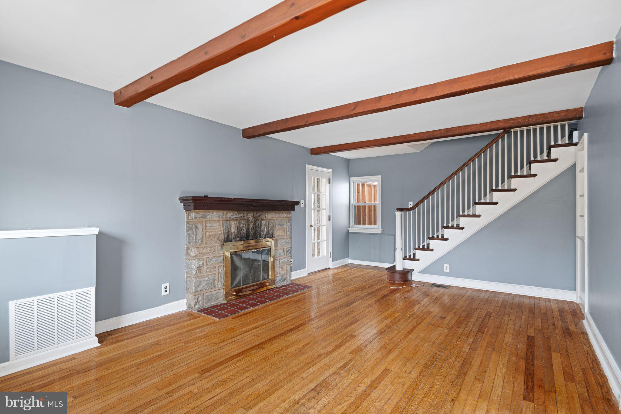 4310 State Road Drexel Hill, PA 19026 - Photo 3 of 24 a view of empty room with wooden floor and fireplace