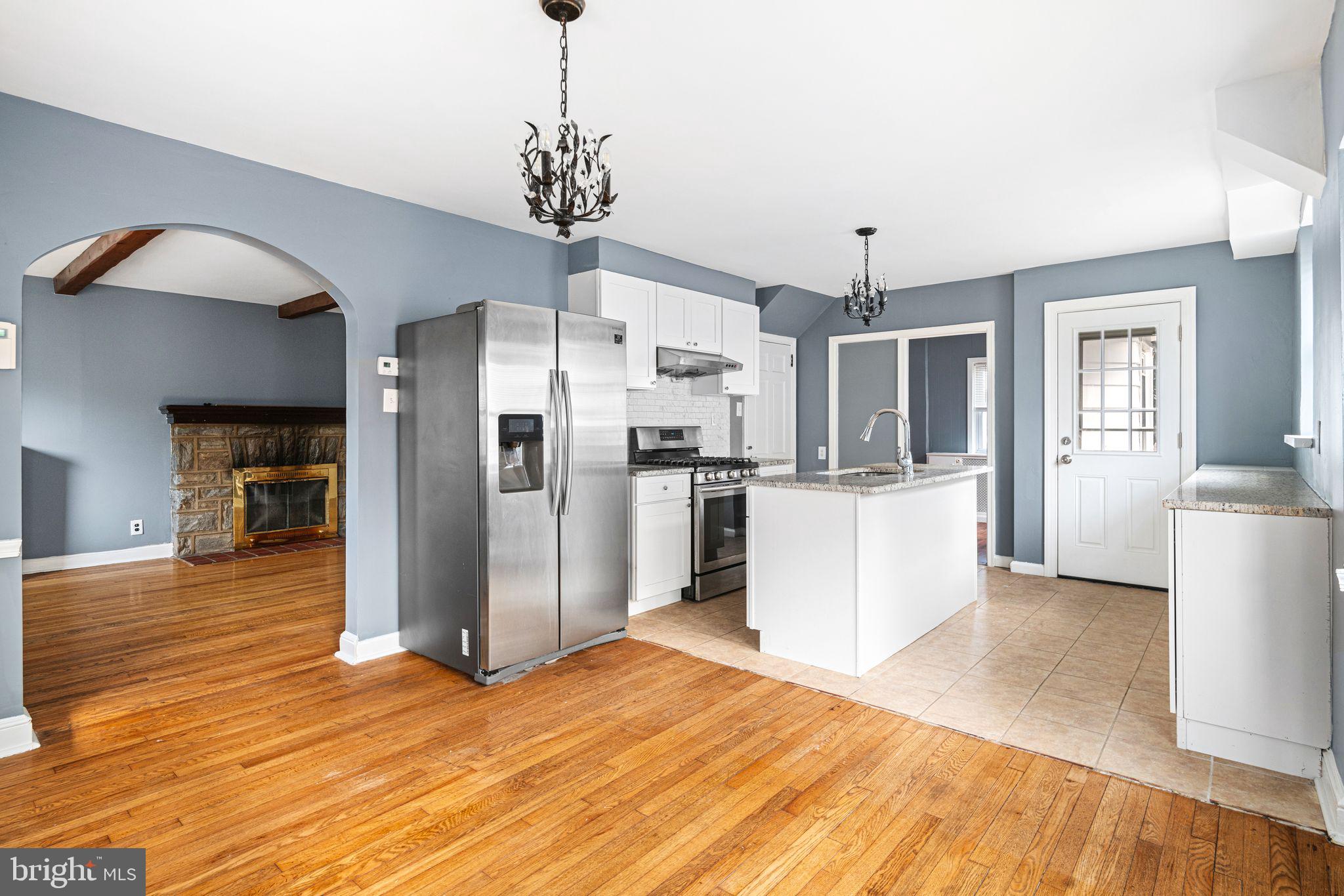 4310 State Road Drexel Hill, PA 19026 - Photo 6 of 24 a view of a kitchen with refrigerator and wooden floor