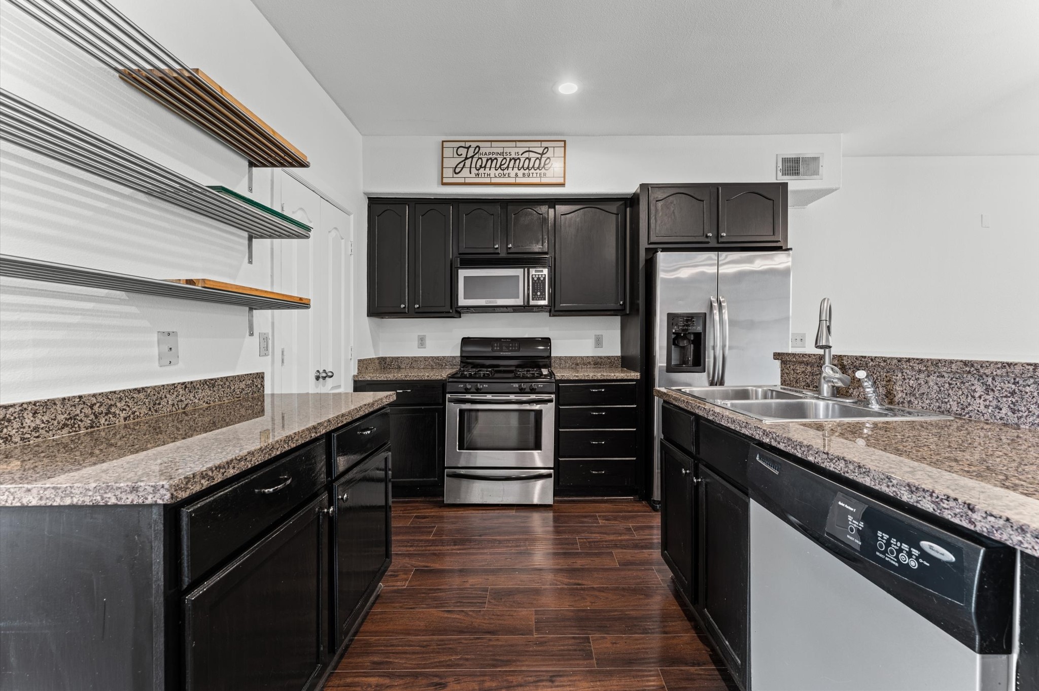 1602 Elgin Street, Unit 10 Houston, TX 77004 - Photo 4 of 21 The kitchen and living areas connect seamlessly, creating a comfortable, open feel throughout the unit's first floor.