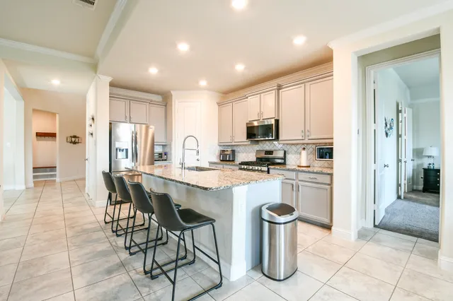 a living room with fireplace furniture and a flat screen tv