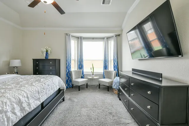 a kitchen with stainless steel appliances granite countertop a table chairs sink and cabinets