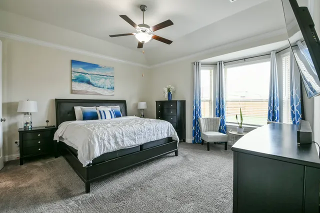 a kitchen with stainless steel appliances granite countertop a stove top oven a sink a refrigerator and a granite counter tops