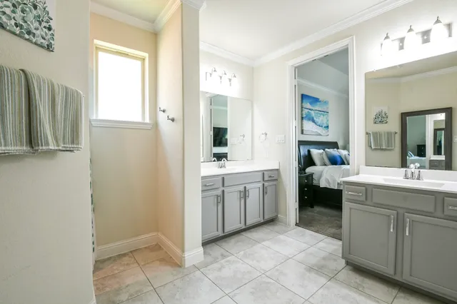 a view of a dining room with a table and chairs