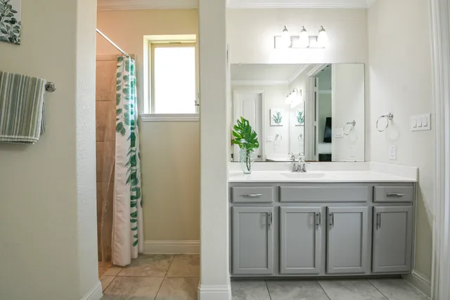a hallway with a dining table chairs with kitchen view