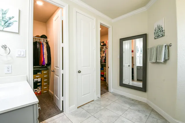 a bedroom with a large bed and a large window