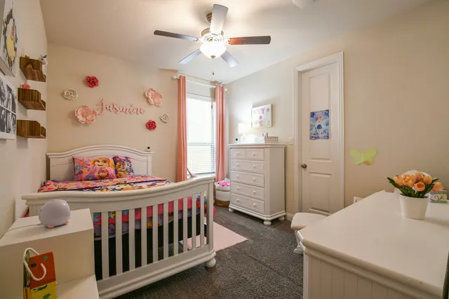 a bathroom with a granite countertop sink a mirror and a shower