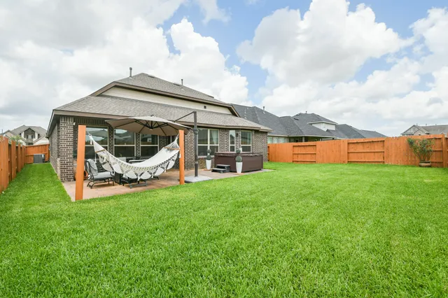 a view of a room with gym equipment and a window