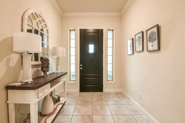 a view of a hallway with front door
