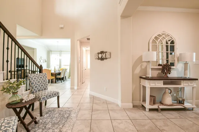 a view of hall way with furniture