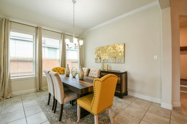 a dining room with furniture and window