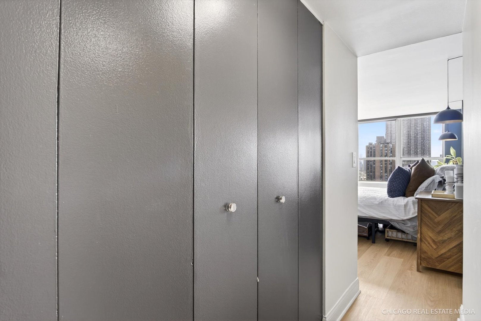 655 West Irving Park Road, Unit 1101 Chicago, IL 60613 - Photo 19 of 26 a view of a bedroom with workspace