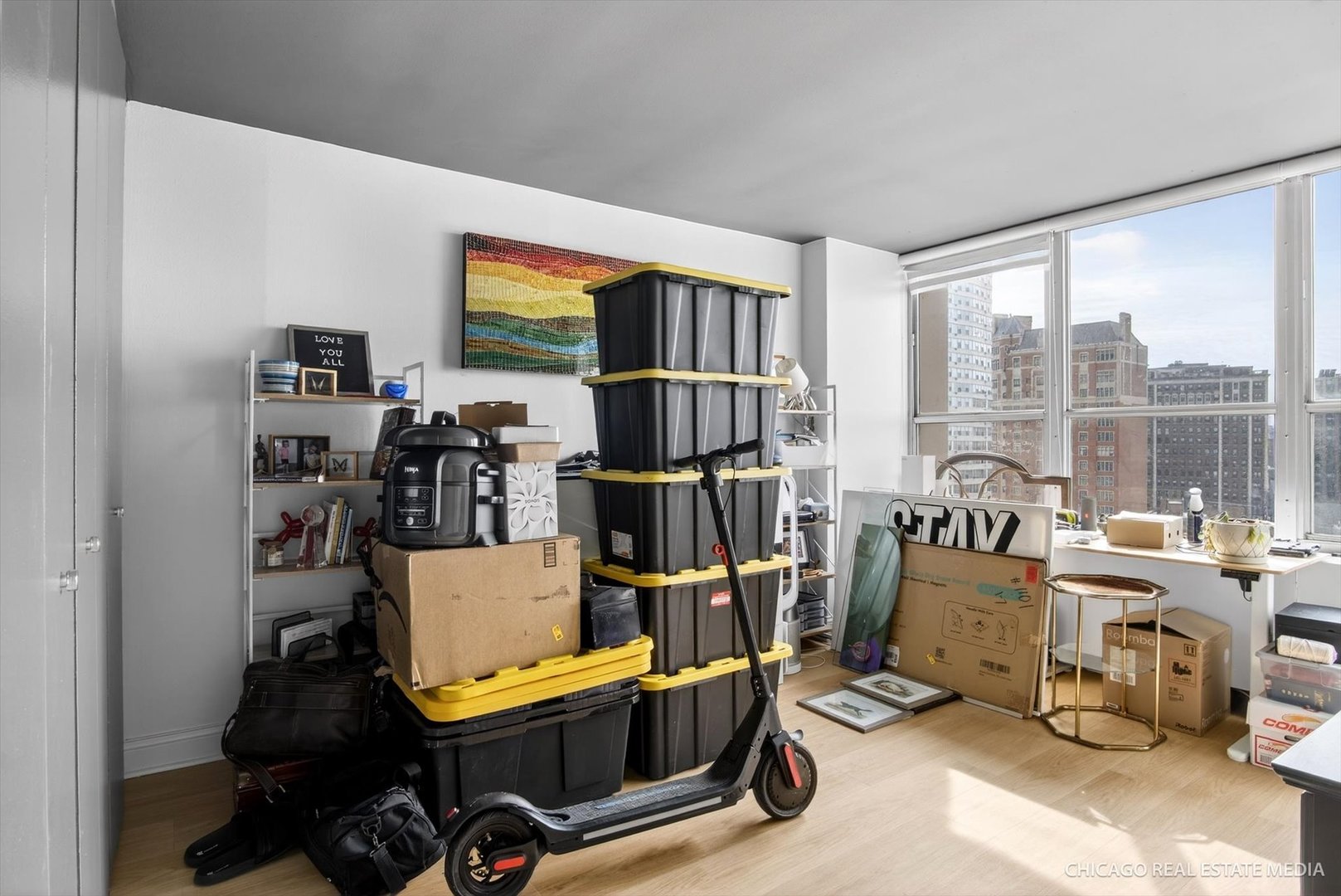 655 West Irving Park Road, Unit 1101 Chicago, IL 60613 - Photo 20 of 26 a view of a workspace with furniture and a window