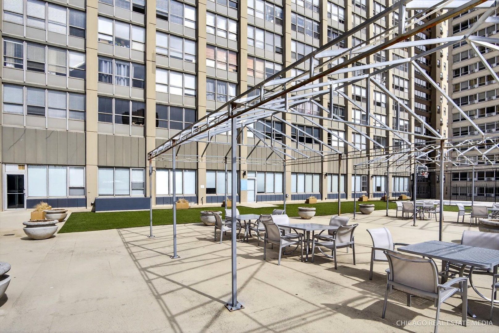 655 West Irving Park Road, Unit 1101 Chicago, IL 60613 - Photo 23 of 26 a view of a building with sitting area