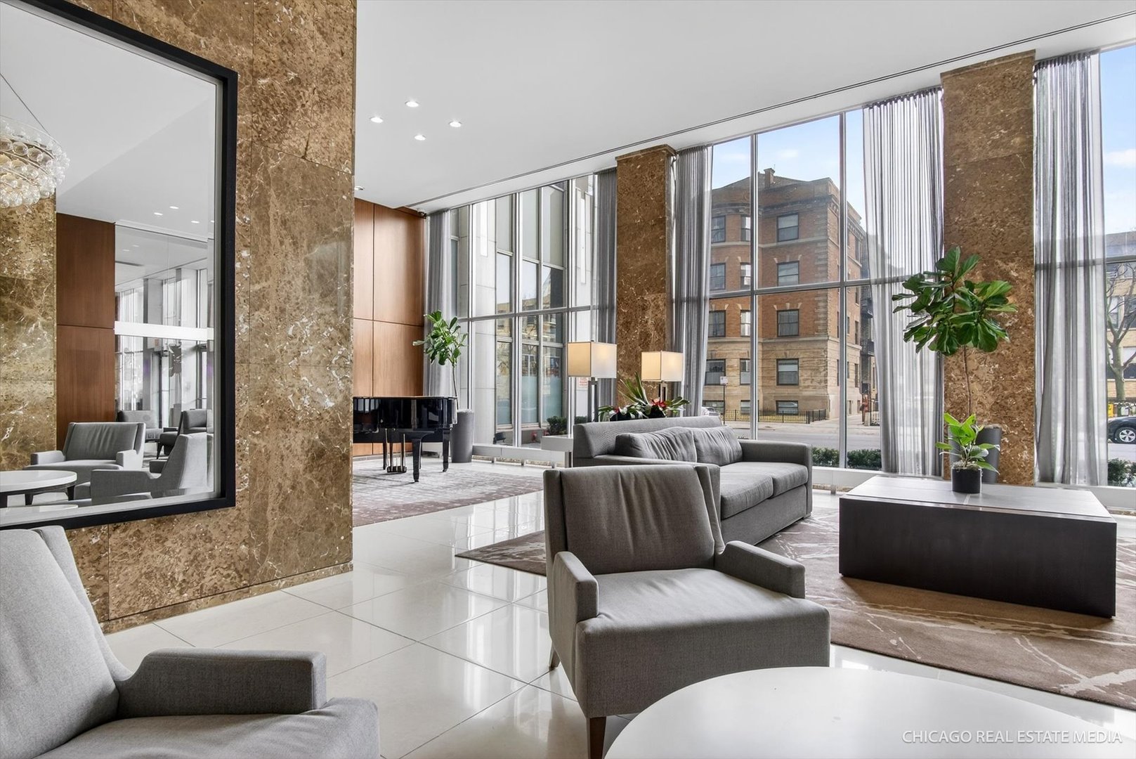 655 West Irving Park Road, Unit 1101 Chicago, IL 60613 - Photo 3 of 26 a living room with furniture and a large window