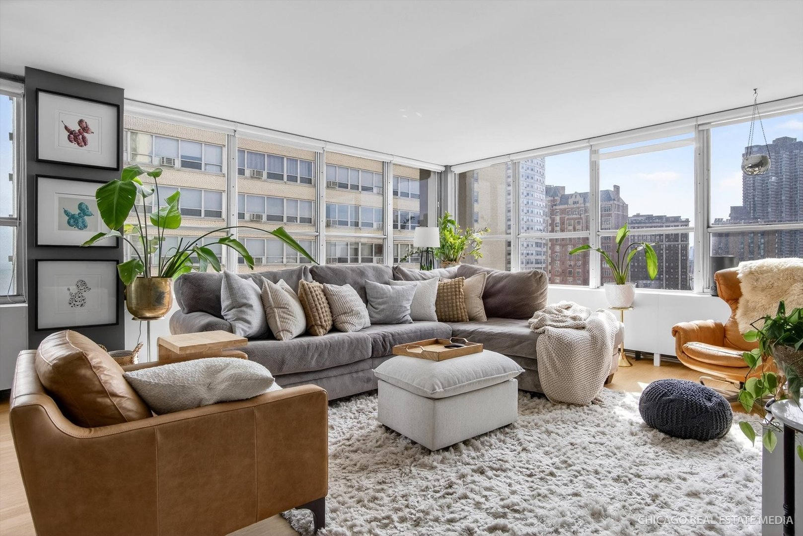 655 West Irving Park Road, Unit 1101 Chicago, IL 60613 - Photo 5 of 26 a living room with furniture and a large window