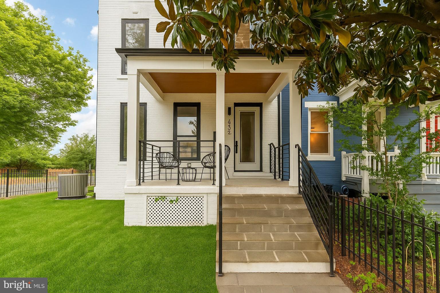 1631 G Street Southeast Washington, DC 20003 - Photo 2 of 42 a view of a house with a small yard and large tree